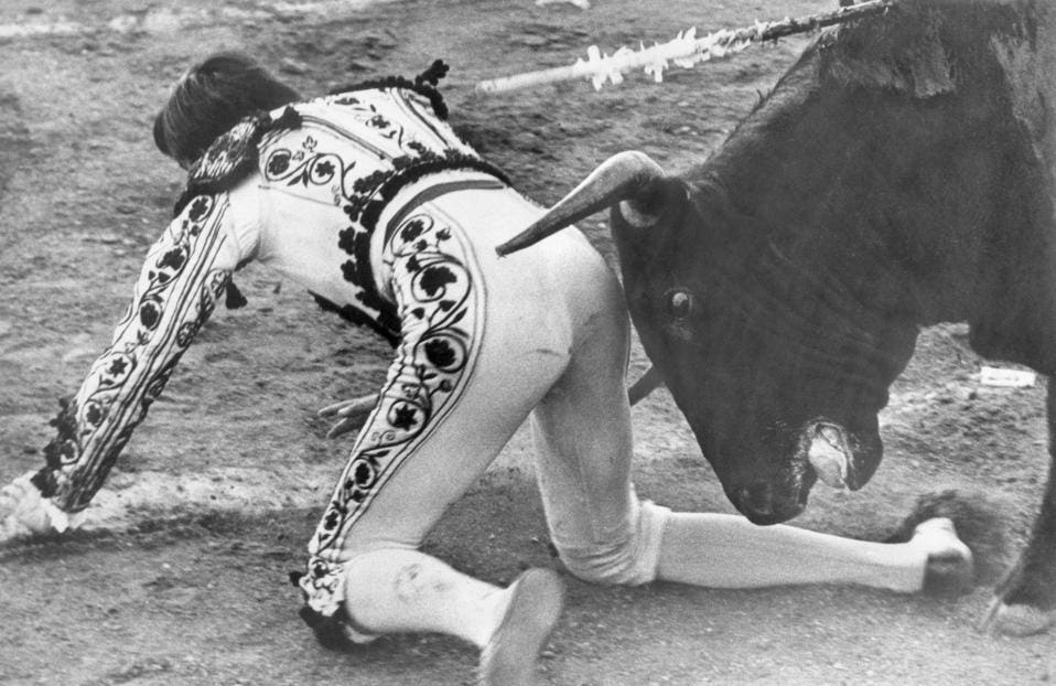 Bullfighter Getting a Nudge From the Bull